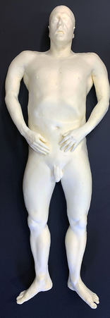 Raw Polyfoam prosthetic dummy without silicone skin, for use in the background of shots providing a basic human form.
